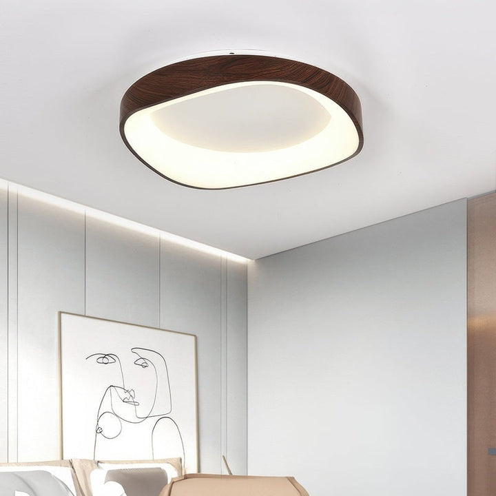 Dark walnut wood grain LED ceiling lamp, minimalist Scandinavian flush mount above bed