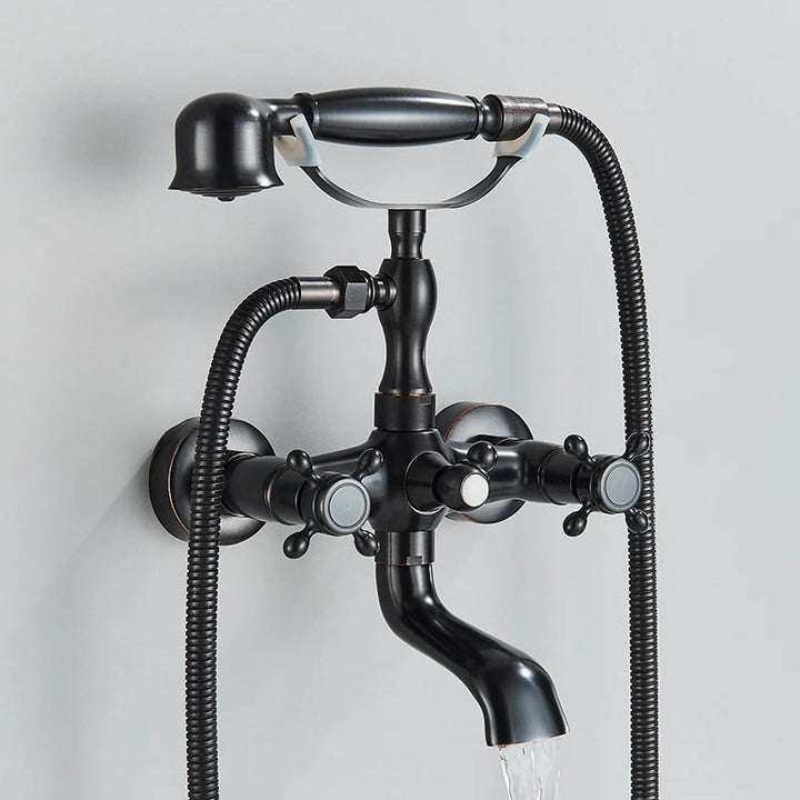 Matte black vintage wall-mounted bathtub faucet set with handheld shower and arched spout for elegant modern bathrooms.
