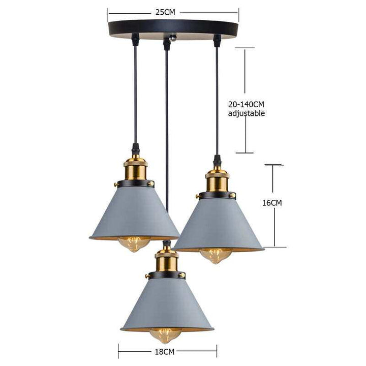 Grey vintage industrial pendant lights in set of three, brass detail, with adjustable hanging cords.