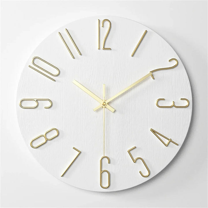 Modern 12inch White wall clock with gold numbers and hands on a light grey background