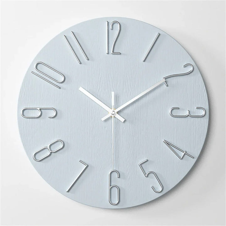 Silver wall clock with metallic finish on a white background