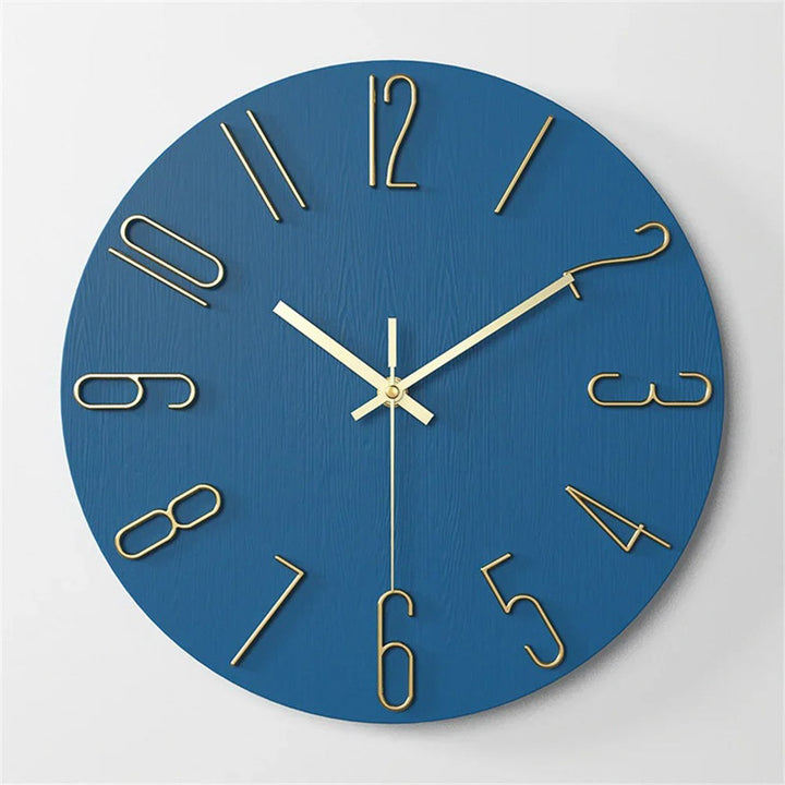 Blue  12inch wall clock with gold hands and numbers on a light gray background