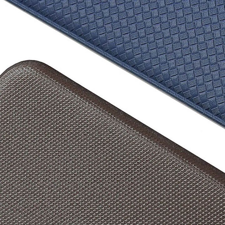 Two textured kitchen mats, one blue and one brown, on a white background