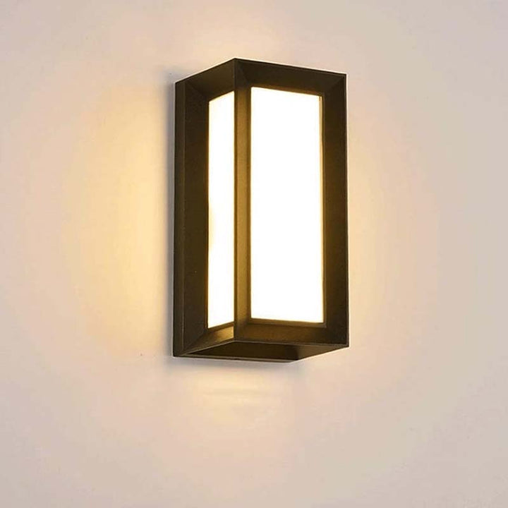 Modern wall-mounted light fixture on a plain background