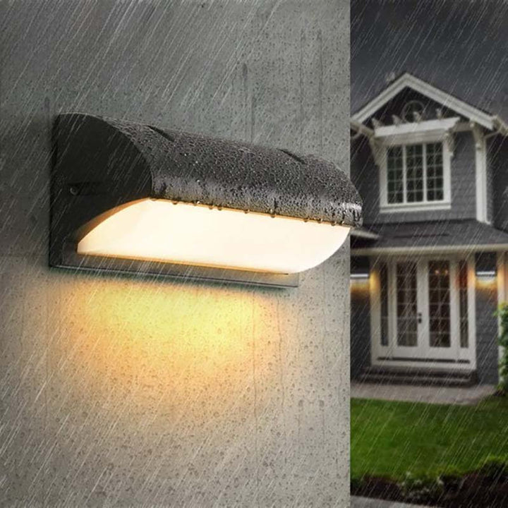 Outdoor wall light fixture on a house exterior with rain simulation