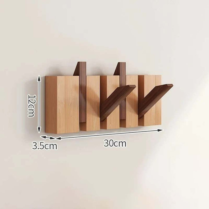 Wooden wall-mounted coat rack with dimensions labeled on a beige background