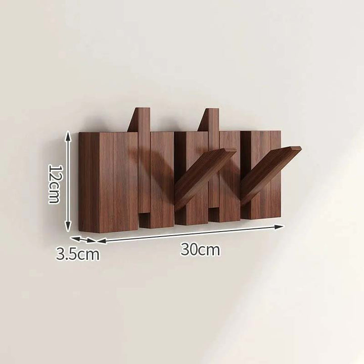 Wooden wall-mounted coat rack with dimensions indicated on a beige background