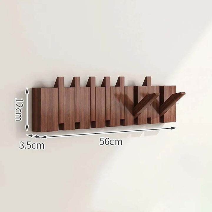 Wooden wall-mounted coat rack with dimensions indicated on a light background