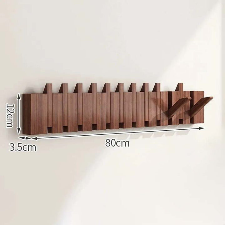 Wooden wall-mounted coat rack with dimensions indicated on a white background