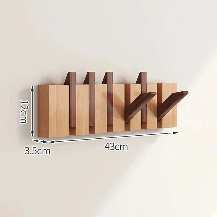 Wooden wall-mounted coat rack with dimensions indicated on a plain background