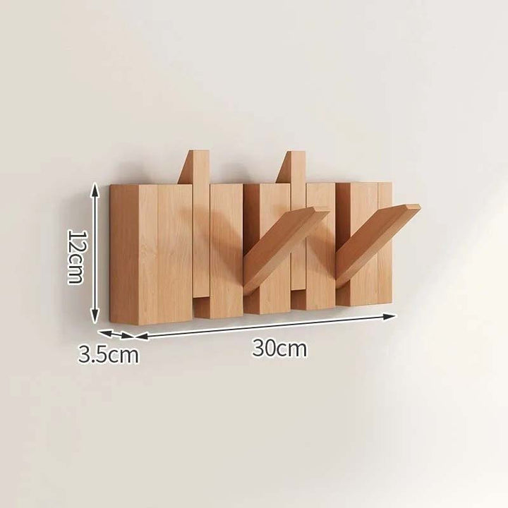 Wooden wall-mounted coat rack with dimensions labeled on a beige background
