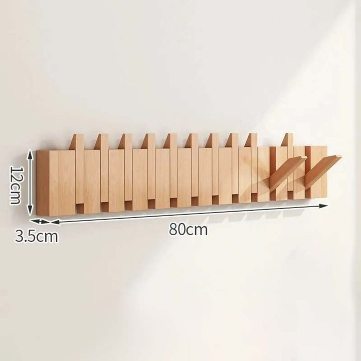Wooden wall-mounted coat rack with dimensions indicated on a white background