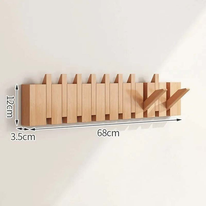 Wooden wall-mounted coat rack with dimensions indicated on a white background