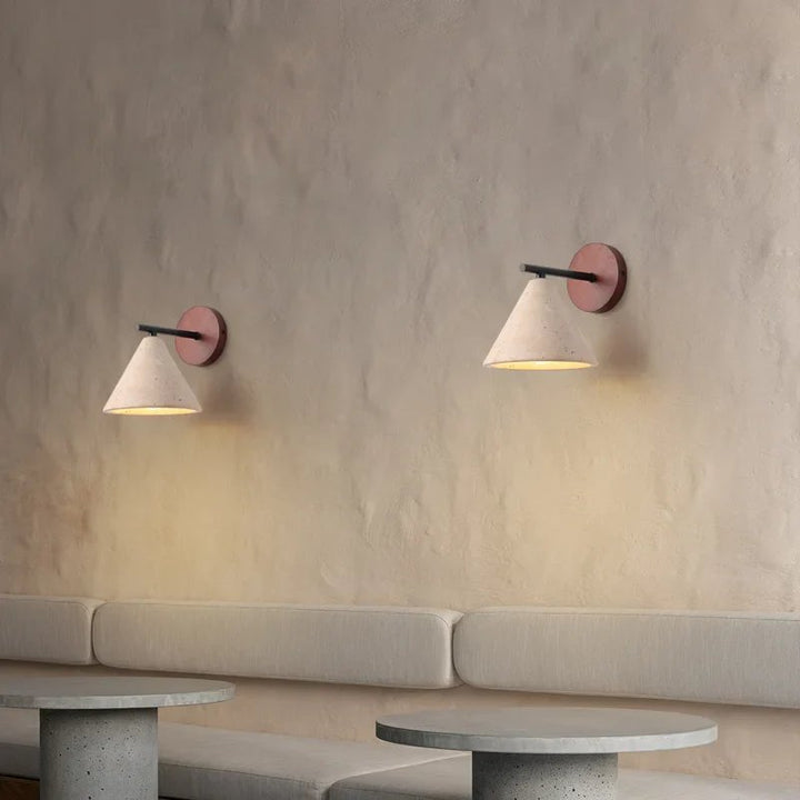 Two, natural stone wood base LED Lights with warm LED glow above tables in UK Scandinavian-inspired interior.