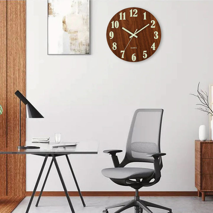 Modern office setup with a desk, chair, and wooden wall clock.