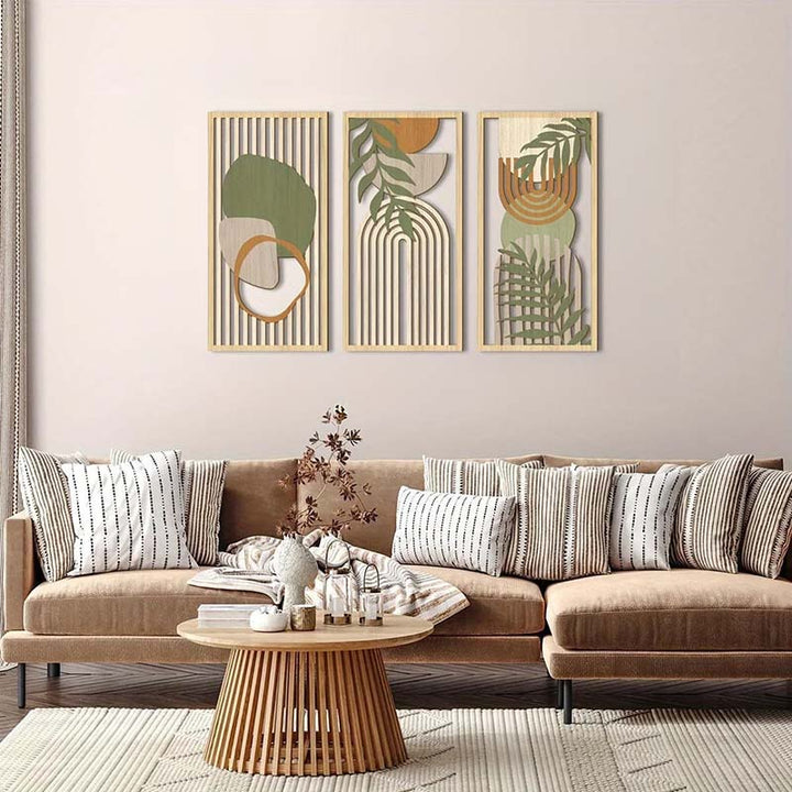 Modern living room with a beige sectional sofa, decorative pillows, and abstract wall art.