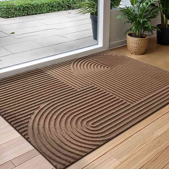 A brown Time arc anti-slip door mat, a minimalist rug with a safe non-slip rubber base for modern homes.
