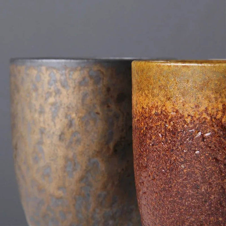 Set of vintage-style ceramic mugs in red-brown and black glaze with wooden handles, Nordic Essentials rustic tea set